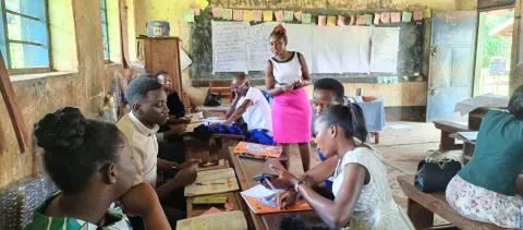 a group of teachers working together in a classroom