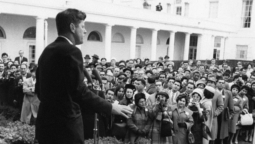 JFK addresses a group at the White House