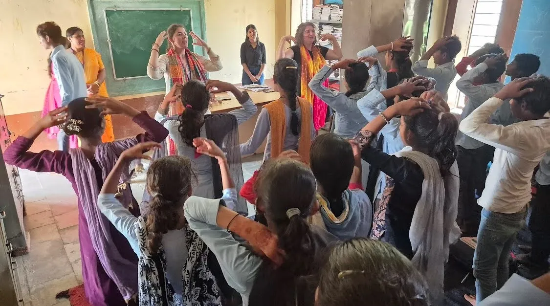 Fulbright Teachers at the front of a classroom in India